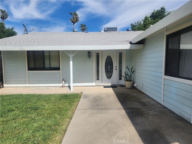 5956 York Glen Way, Sacramento, CA 95842 - doorway to property featuring covered porch and roof with shingles