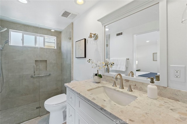 7042 Stonewood Dr, Huntington Beach, CA 92647 - bathroom featuring visible vents, a stall shower, toilet, and vanity