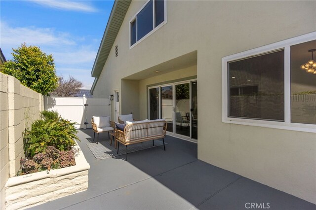 7042 Stonewood Dr, Huntington Beach, CA 92647 - view of patio with an outdoor living space and fence