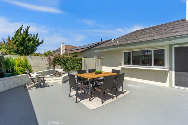 7042 Stonewood Dr, Huntington Beach, CA 92647 - view of patio / terrace featuring an outdoor fire pit, outdoor dining area, and fence