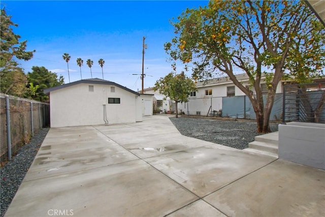 2619 Alice St, Los Angeles, CA 90065 - rear view of house featuring stucco siding, a fenced backyard, and a patio area