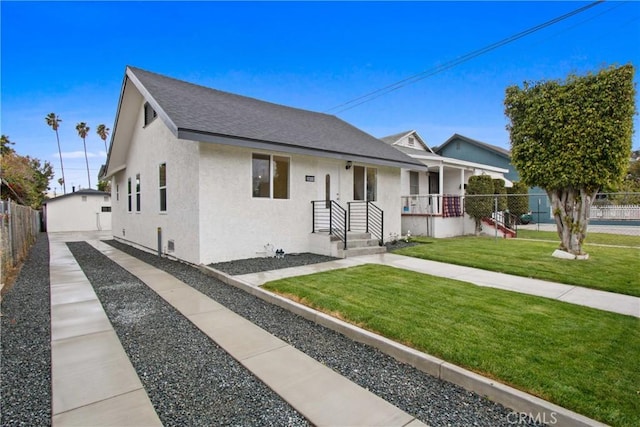 2619 Alice St, Los Angeles, CA 90065 - view of front of property with a front lawn, a shingled roof, stucco siding, and fence