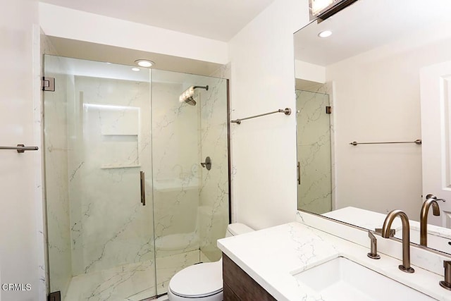 full bathroom with vanity, recessed lighting, a marble finish shower, and toilet