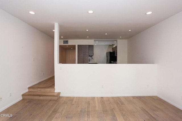 interior space with visible vents, recessed lighting, baseboards, and light wood-type flooring
