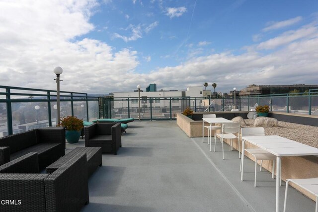 view of patio / terrace featuring fence and an outdoor living space