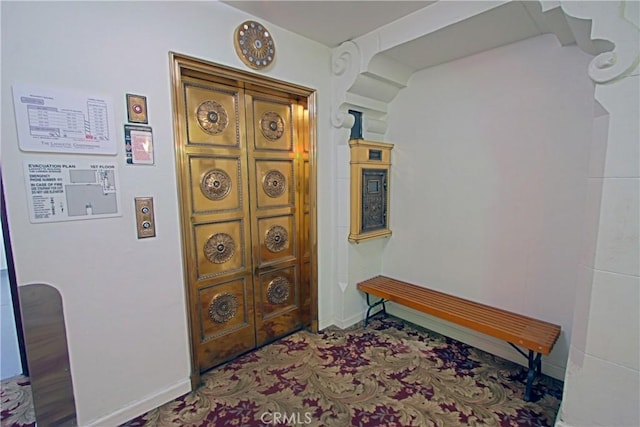 hallway featuring baseboards