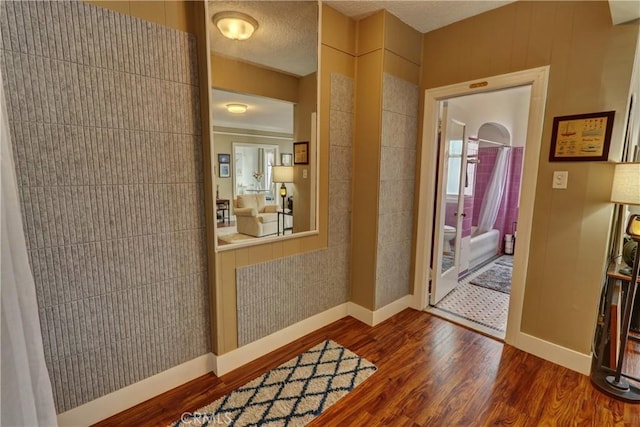 interior space featuring baseboards and dark wood-type flooring