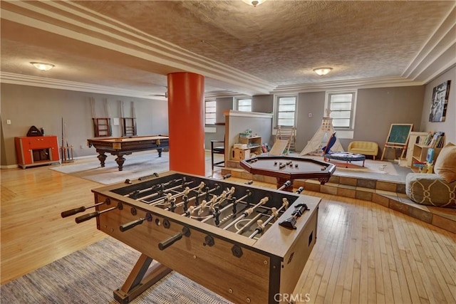 game room featuring crown molding, baseboards, hardwood / wood-style floors, and pool table