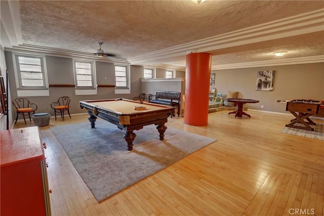 playroom with wood-type flooring, a textured ceiling, baseboards, ornamental molding, and pool table