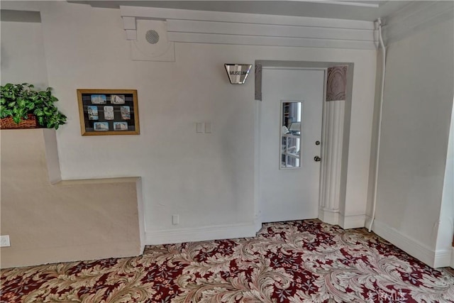 interior space featuring baseboards