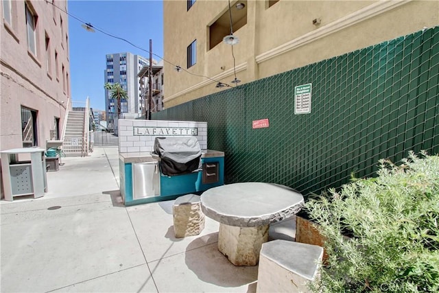 view of patio / terrace featuring fence