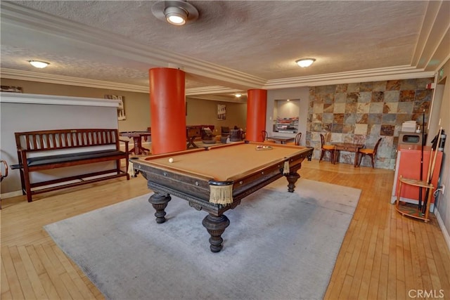 playroom featuring hardwood / wood-style floors, pool table, and a textured ceiling