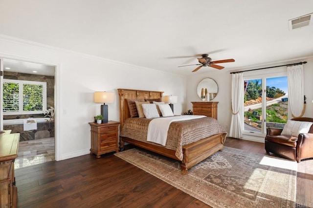 bedroom featuring multiple windows, dark wood-type flooring, visible vents, and ornamental molding