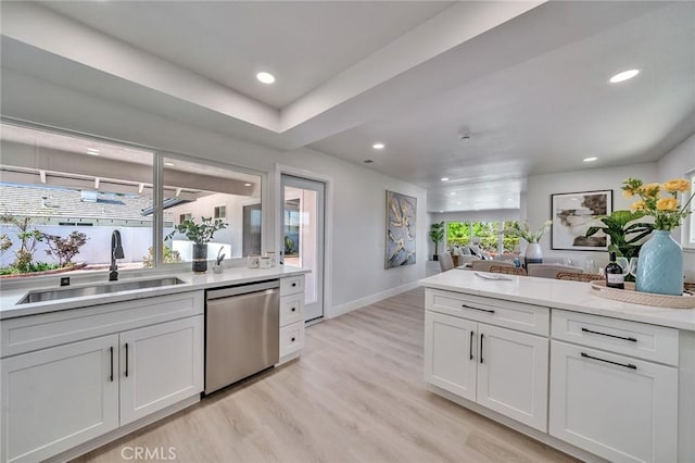 29461 Via Valverde, Laguna Niguel, CA 92677 - kitchen featuring white cabinets, a sink, open floor plan, light wood-style floors, and dishwasher