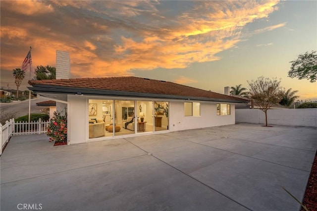 29461 Via Valverde, Laguna Niguel, CA 92677 - back of house featuring stucco siding, a patio area, a chimney, and fence
