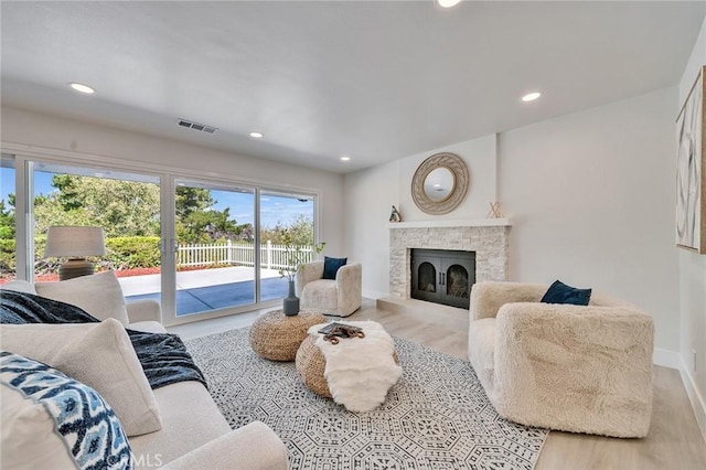 29461 Via Valverde, Laguna Niguel, CA 92677 - living room with recessed lighting, a fireplace with raised hearth, wood finished floors, visible vents, and baseboards