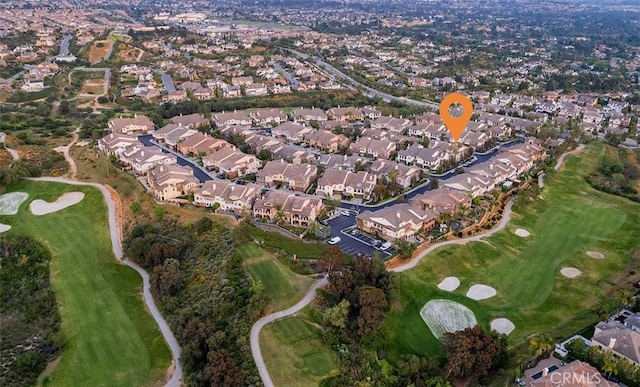 drone / aerial view featuring a residential view and view of golf course
