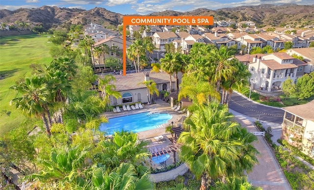 birds eye view of property featuring a mountain view and a residential view