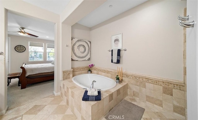 ensuite bathroom with ceiling fan, tile patterned flooring, ensuite bathroom, and a bath