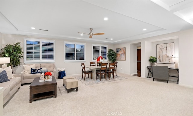 carpeted living room with recessed lighting, a ceiling fan, baseboards, and a tray ceiling