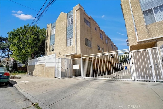 view of building exterior with fence