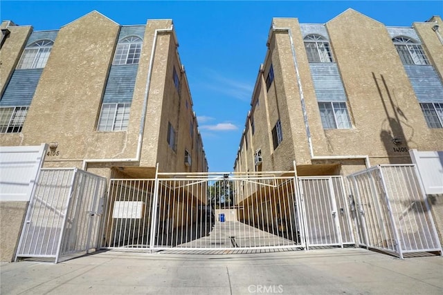view of property with fence