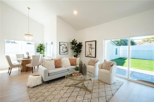 1933 Fanwood Ave, Long Beach, CA 90815 - living area with light wood-type flooring, high vaulted ceiling, and a chandelier