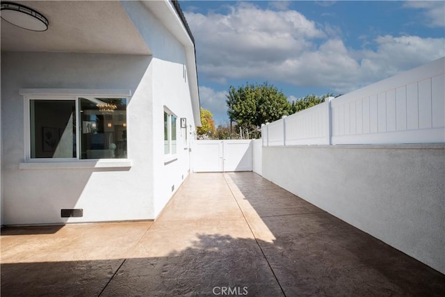 1933 Fanwood Ave, Long Beach, CA 90815 - view of side of property with stucco siding and a patio