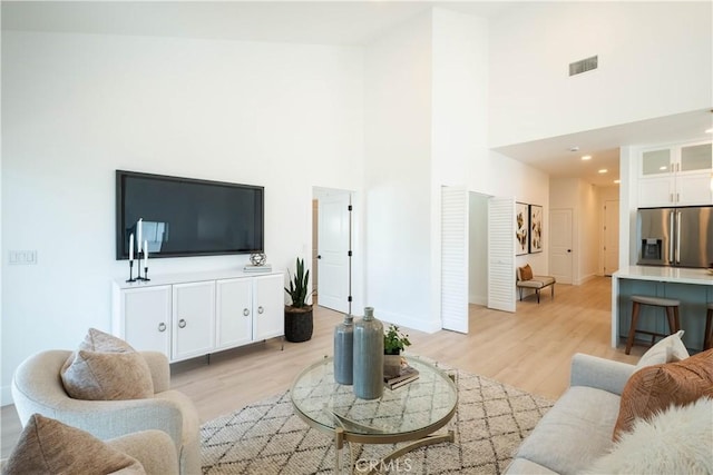 1933 Fanwood Ave, Long Beach, CA 90815 - living area with a towering ceiling and light wood-type flooring