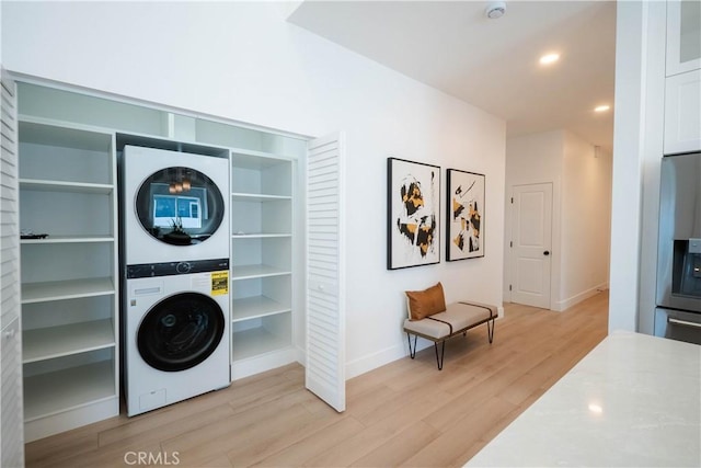 1933 Fanwood Ave, Long Beach, CA 90815 - laundry room with stacked washer and clothes dryer, light wood finished floors, and recessed lighting