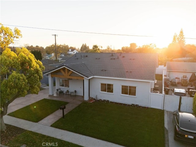 1933 Fanwood Ave, Long Beach, CA 90815 - rear view of property featuring stucco siding, a gate, a tile roof, and a patio