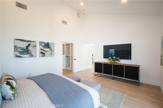 1933 Fanwood Ave, Long Beach, CA 90815 - bedroom with light wood finished floors, high vaulted ceiling, a walk in closet, and recessed lighting