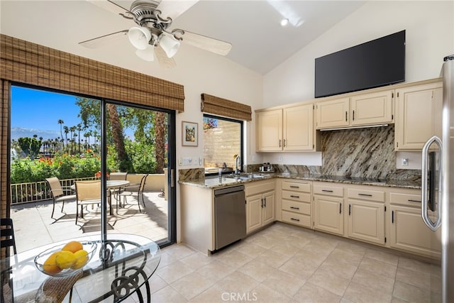 175 Bouquet Canyon Dr, Palm Desert, CA 92211 - kitchen featuring light stone countertops, a ceiling fan, appliances with stainless steel finishes, a sink, and backsplash