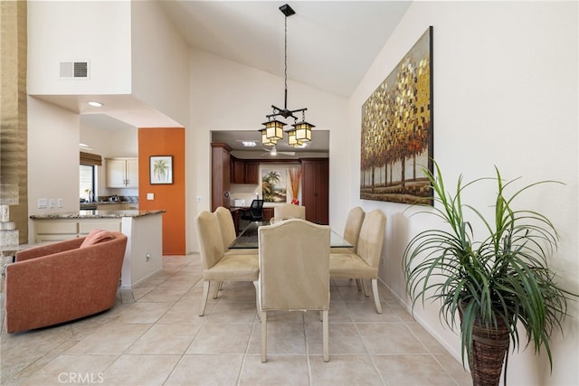 175 Bouquet Canyon Dr, Palm Desert, CA 92211 - dining space featuring high vaulted ceiling, visible vents, an inviting chandelier, and light tile patterned floors