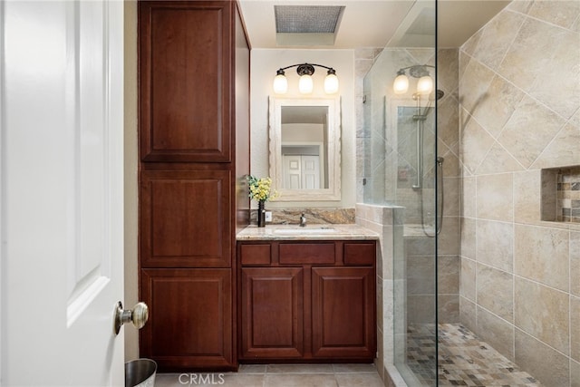 175 Bouquet Canyon Dr, Palm Desert, CA 92211 - bathroom with visible vents, a tile shower, tile patterned flooring, and vanity