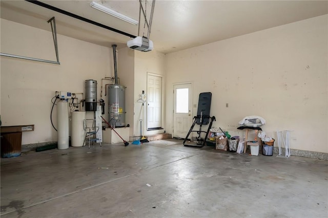 garage featuring a garage door opener and water heater