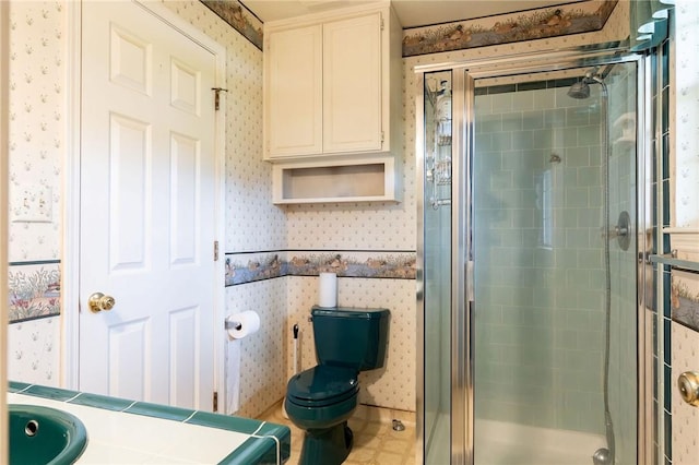 full bath featuring toilet, a stall shower, and wallpapered walls
