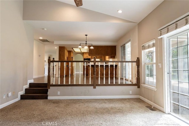 unfurnished room featuring visible vents, carpet, and baseboards