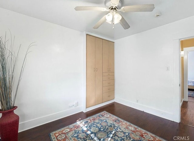 3654 7th Ave, Los Angeles, CA 90018 - bedroom with a ceiling fan, dark wood-type flooring, and baseboards