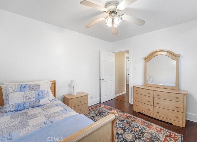3654 7th Ave, Los Angeles, CA 90018 - bedroom with dark wood-style floors, baseboards, and ceiling fan
