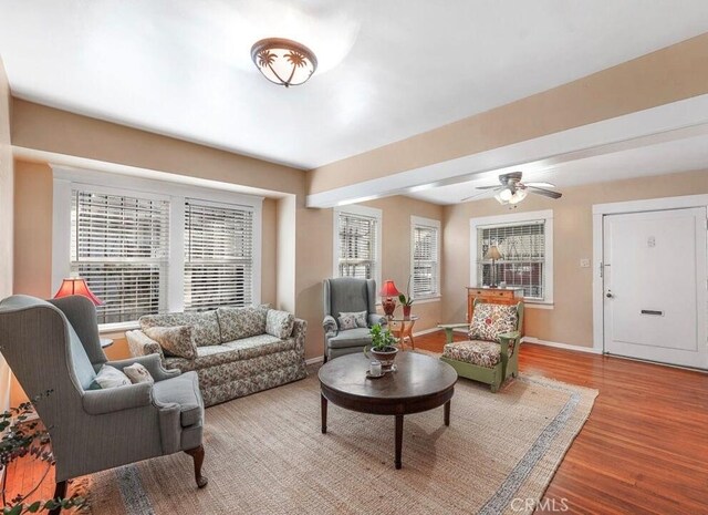 3654 7th Ave, Los Angeles, CA 90018 - living area with baseboards, ceiling fan, and wood finished floors