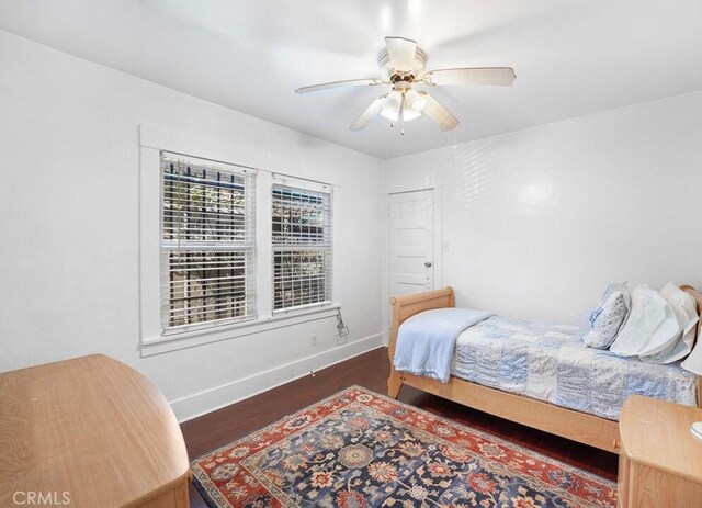 3654 7th Ave, Los Angeles, CA 90018 - bedroom featuring baseboards, wood finished floors, and a ceiling fan