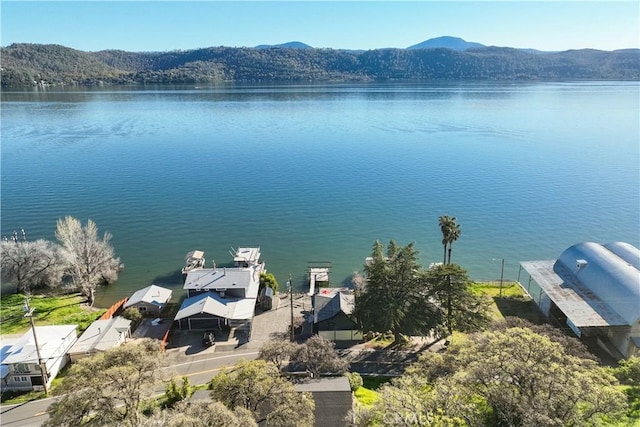 bird's eye view with a water and mountain view