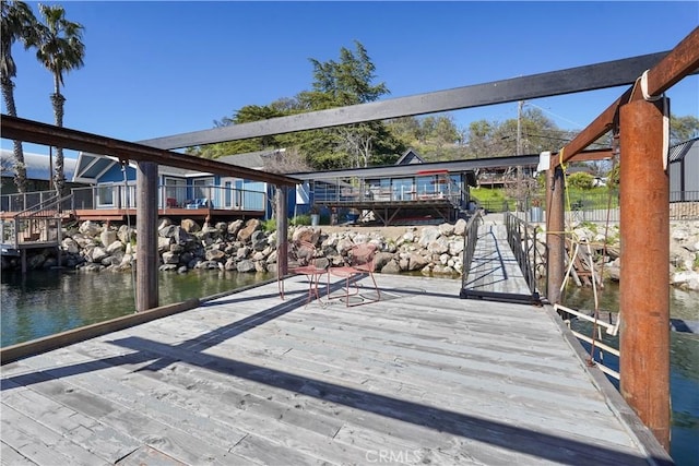 dock area with a deck with water view