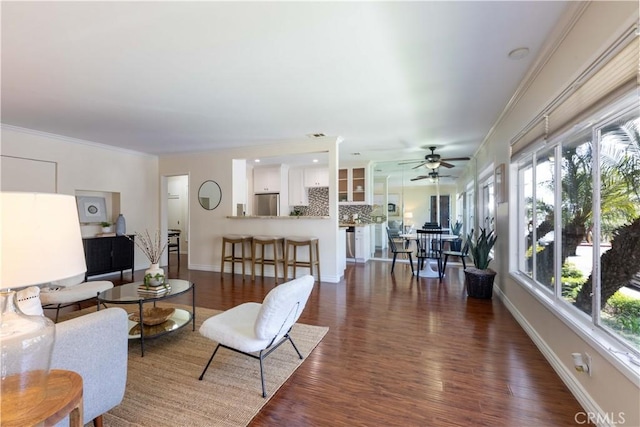6 5th Pl, Long Beach, CA 90802 - living room featuring plenty of natural light, a ceiling fan, baseboards, dark wood-type flooring, and ornamental molding