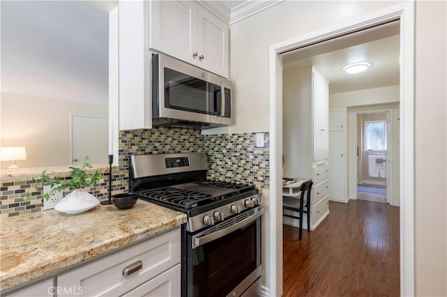 6 5th Pl, Long Beach, CA 90802 - kitchen with stainless steel appliances, white cabinetry, tasteful backsplash, and light stone counters