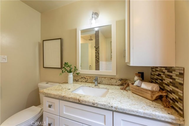 6 5th Pl, Long Beach, CA 90802 - bathroom featuring toilet, vanity, and backsplash