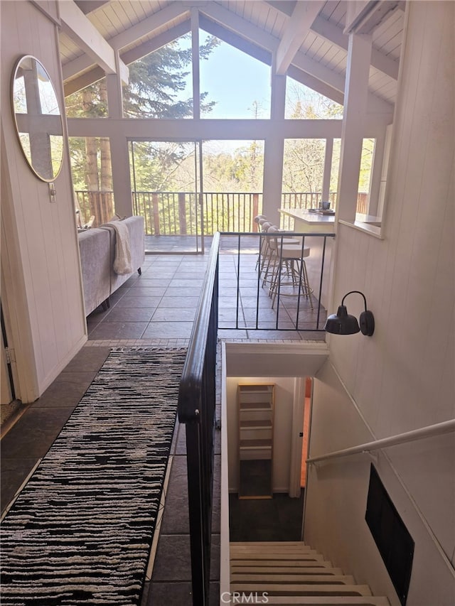 628 Rose Ln, Twin Peaks, CA 92391 - staircase featuring wooden walls, lofted ceiling with beams, and a healthy amount of sunlight