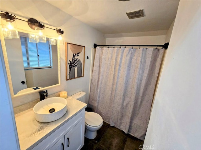 bathroom featuring a shower with curtain, visible vents, toilet, tile patterned floors, and vanity