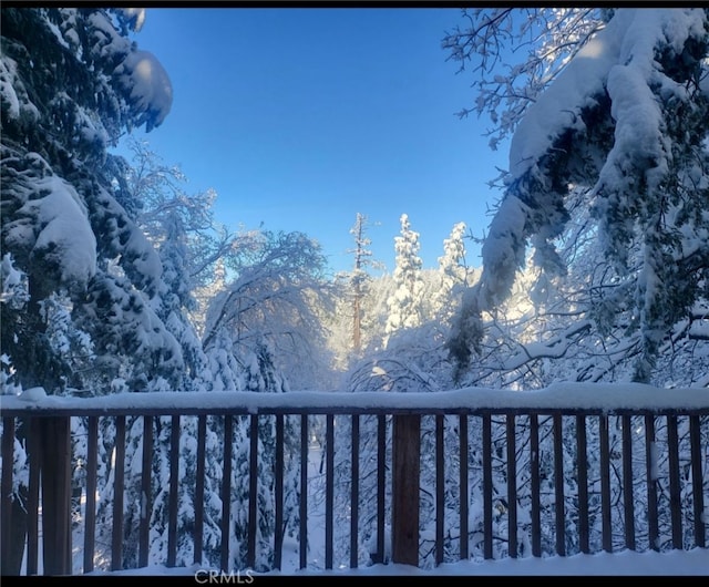 view of snow covered deck
